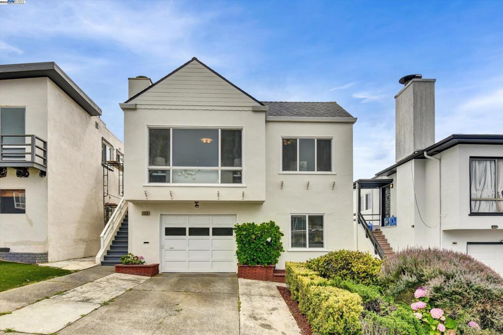 Located in the desirable Westlake neighborhood, this classic mid-century home offers ocean views, timeless architectural character, and unbeatable urban convenience. The updated kitchen features sleek quartz countertops, a gas stove, stainless steel appliances, and a bar—perfect for cooking and entertaining. The open-concept living and dining area is anchored by a wood-burning fireplace and large picture windows that fill the space with natural light and ocean views. Three bedrooms and one full bath are located on the main floor. The lower level includes a laundry, fourth bedroom, additional full bath, and flexible bonus room with direct access to the 1 car garage and backyard—ideal for a home office, gym, or guest suite. Outside, the level rear yard offers a versatile space for entertaining, gardening, or play. Additional highlights include freshly painted interiors, refinished hardwood floors, and a permitted lower level for expanded living potential.Enjoy easy access to public transit, major freeways, scenic hiking trails, parks, golf courses, and top shopping destinations like 99 Ranch, Westlake Shopping Center, and Serramonte. Close to Palisades Park and Avalon Canyon, this home offers a rare combination of natural beauty and walkability in a coastal setting.