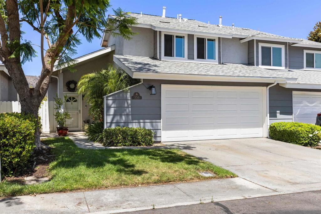 Welcome to this beautifully maintained 3 bedroom, 2.5 bathroom, two-story home located on a hill in the highly sought after Twin Oaks community of San Marcos. The remodeled kitchen features modern finishes and new appliances, while central A/C and all new dual-pane windows and doors which provide year round comfort and energy efficiency and a new roof was installed in 2024. Tall ceilings and plenty of natural light create an inviting atmosphere throughout. Step outside to a spacious private yard with sweeping westerly views, perfect for relaxing evenings or entertaining guests. The two-car garage includes an electric vehicle charger and an abundance of storage. Enjoy community amenities such as a pool and playground, all with a low HOA fee. Convenient access to colleges, hospitals, shopping, Lake San Marcos, and more!