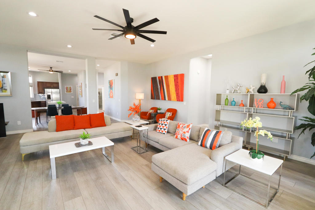 This 3-bedroom, 2-bathroom beauty, built in 2006, boasts just under 2,000 square feet of thoughtfully designed living space. Featuring soaring 12-foot ceilings, a modern Santa Fe style, and an open-concept floor plan, this home exudes comfort and elegance. Recent updates include a brand-new AC unit and water heater.The spacious living room is highlighted by a sleek LED fireplace, perfect for cozy evenings. Step outside to enjoy the pool-sized backyard with mature trees, a covered patio, and a gated perimeter for added privacy. The 2-car garage, quartz countertops in the kitchen, and a laundry room with a convenient sink complete the package.Situated in the prestigious Mary Pickford's B-Bar H Ranch, renowned for its mid-century modern homes and vacation destinations, this home is truly move-in ready and offers a rare opportunity in a prime location.