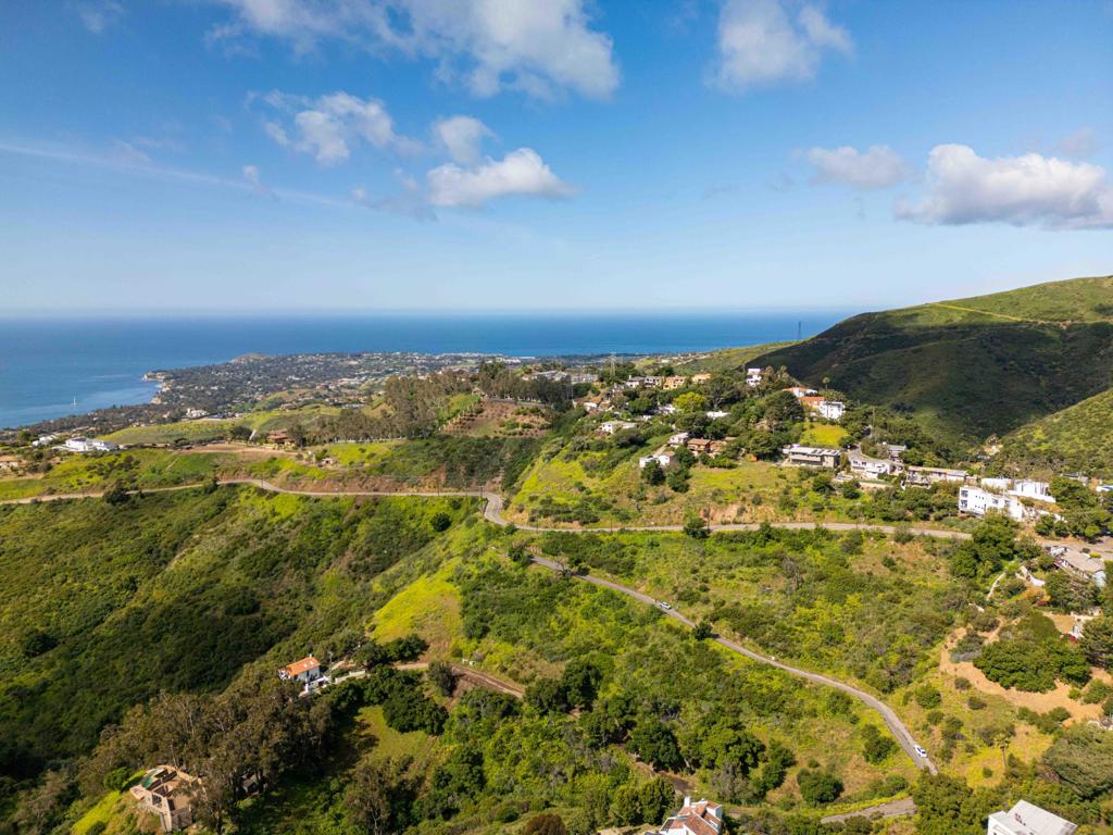 Discover breathtaking ocean and mountain views in Malibu's Lower Latigo Canyon! This parcel, close to PCH yet serene, offers a peaceful rural setting minutes from the beach. With an ascending topography leading to a potential flat pad, it's easily accessible by paved road and has nearby water and electricity. TOPO Map is available on request.