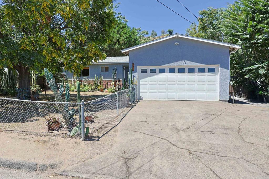 Welcome to your private oasis! This beautifully updated single-story home sits on a generously sized lot with lush, mature landscaping and a tranquil setting near Lindo Lake Park and scenic walking trails. Inside, you'll find a spacious layout with an upgraded kitchen featuring GE appliances, remodeled bathrooms, and wide-plank commercial-grade LVP flooring throughout. The expansive family room or game room offers endless possibilities for entertaining or relaxing. Step outside to your resort-style backyard, complete with a sparkling pool, spa, and water slide, surrounded by vibrant succulents, large cacti, and fruit trees including lime, lemon, and pomegranate. There’s also a thriving veggie garden and blueberry bushes, all set within a private, shaded retreat. Enjoy energy efficiency and peace of mind with owned solar (17 panels) and a newer roof. This home blends modern comfort with natural beauty—truly a rare find!