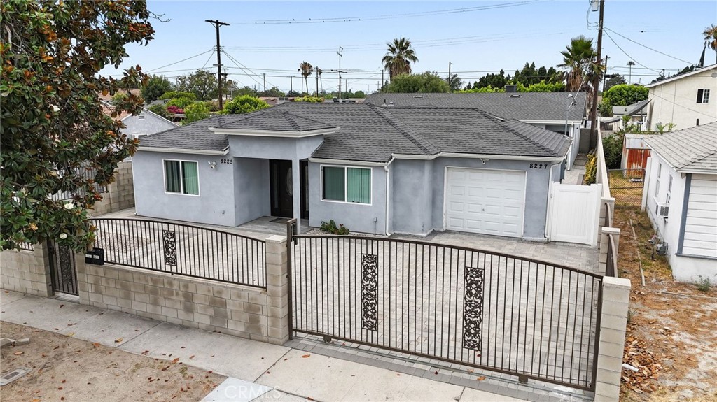 This centrally located home features 4 bedrooms and 2 bathrooms and has been recently renovated with a modern open floor plan. The spacious kitchen is equipped with stainless steel appliances, quartz countertops, and ample cabinetry, making it perfect for both daily living and entertaining. Generously sized bedrooms and updated bathrooms offer comfort and functionality. Step outside to a large patio area with an attached covered porch and ceiling fan—ideal for relaxing or hosting gatherings. The fully private yard is secured with a gate, and the washer and dryer are conveniently located at the back of the house.