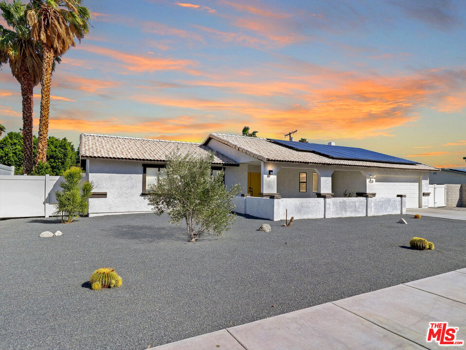 Welcome to 1920 N San Gorgonio Rd, a striking residence in the heart of Palm Springs that perfectly balances modern design with timeless desert elegance. From the moment you arrive, the curb appeal impresses with lush, manicured landscaping and a facade that marries clean contemporary lines with the classic Palm Springs vibe. Inside, soaring ceilings and an open-concept layout create a bright, airy atmosphere, while designer finishes and a refined color palette add sophistication to every space. The gourmet kitchen is a true showpiece, equipped with top-tier stainless steel appliances, custom cabinetry, and an oversized island ideal for casual dining or entertaining. The adjacent dining and living areas flow seamlessly, offering both comfort and style for everyday living and special gatherings alike. Step outdoors and discover your own private retreat. A sparkling pool and spa sit at the center of the backyard oasis, complemented by a massive covered pergola and shaded lounge areas. Eight-foot privacy fencing, lush greenery, and serene mountain views ensure the ultimate in relaxation and seclusion, perfect for enjoying the Palm Springs lifestyle year-round. Recent upgrades elevate the home even further, including a new AC system, solar panels, security cameras, and more. 1920 N San Gorgonio Rd is a home that captures the essence of Palm Springs living modern, stylish, and effortlessly comfortable.
