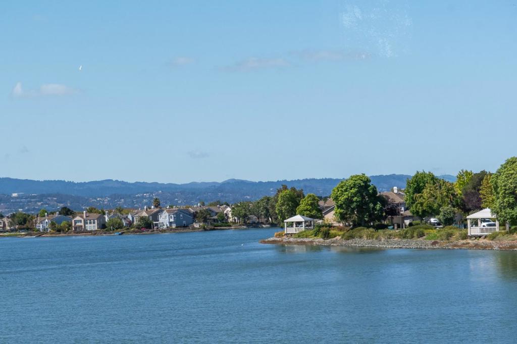 Gorgeous Ultra Wide Waterfront location with a private boat dock! Set sail, SUP, Kayak from your dock. Majestic Waterviews from the Living/Dining/Family Room, Chef's Kitchen and Primary Suite! Pride of Ownership~Attention to detail~Remodeled, Contemporary home. Chef's kitchen with newer cabinets, countertops, stainless steel appliances...even a pot filler above the gas stove! Hardwood-style vinyl plank floor is perfect for high traffic and pets. Spa-like primary bath with dual vanity sinks, LEDs and 2 closets (1 walk-in closet). Private, fenced rear yard with lawn area and patio, apple and lemon tree and raised veggie planter. BTW~SOLAR POWER TOO! Convenient to community pool/spa and sought-after Sandpiper Elementary School. Pets are subject to review with $200/mo more per month and $1000/pet deposit.
