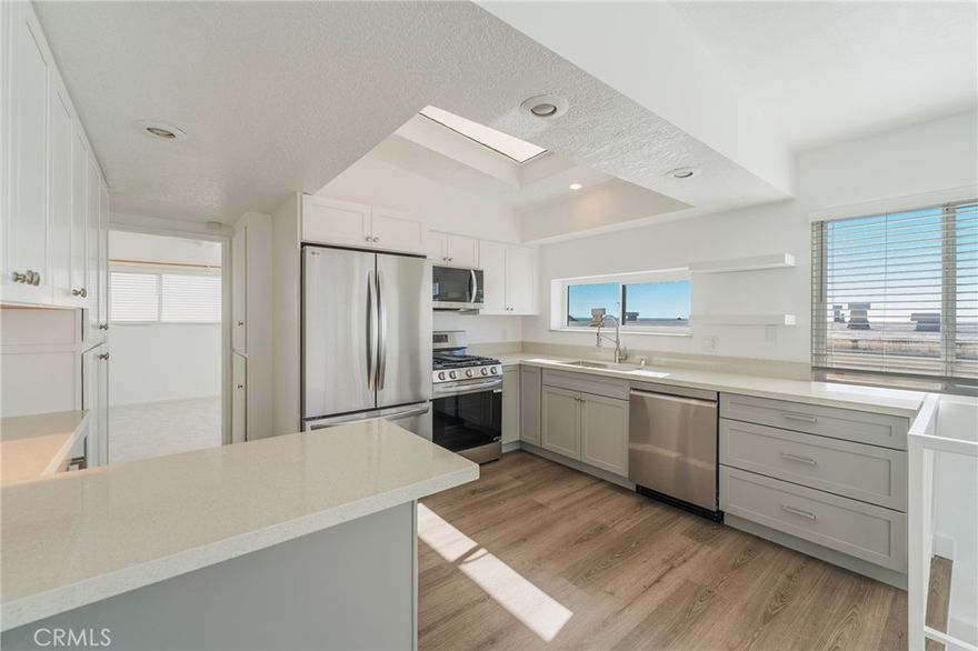 Two, oversized en suite bedrooms make this one the most unique and desirable homes for lease in the downtown area. Available for the first time since a major remodel of the kitchen, both bathrooms and the addition of a dedicated laundry room, this home has the style, status and location to fully enjoy the Manhattan Beach lifestyle. The new kitchen features all new stainless steel appliances including a five-burner gas stove with a griddle, a double door refrigerator with a freezer drawer, a new sink and faucet wand sprayer, functional quartz counter tops and roomy cabinets, cupboards and drawers. The bathroom remodels include new toilets, sink basins and vanities. The spacious 5’ x 9’ laundry room includes a new, full size washer and dryer by Inverter Direct Drive. A new sectional garage door maximizes usable space in the two-car garage. Each bedroom is large (12’ x 18’) (18’ x 15’) and can easily accommodate a king bed with ample room for an office or setting area. Both bedrooms have abundant closet space. The home has good window coverage providing loads of natural light and views of the Palos Verdes Peninsula and Catalina Island.