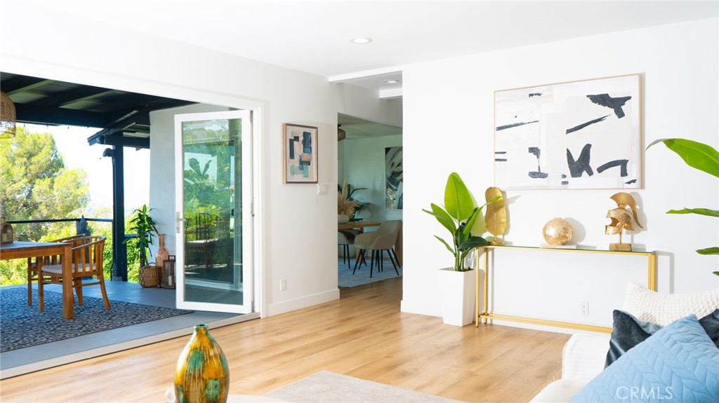 Imagine arriving home in this breathtaking mid-century modern masterpiece, perched high in the FRANKLIN Hills with panoramic views stretching to the Griffith Observatory, the shimmering skyline, and beyond. Vast floor-to-ceiling windows frame sunsets like living artwork, while the open-concept living spaces—warm hardwood floors, and a sleek, gourmet kitchen—invite both grand gatherings and quiet moments of tranquility. With three sumptuous bedrooms and three spa-inspired baths—each a sanctuary of calm—every corner of this luxurious retreat whispers serenity, and pure LA magic.