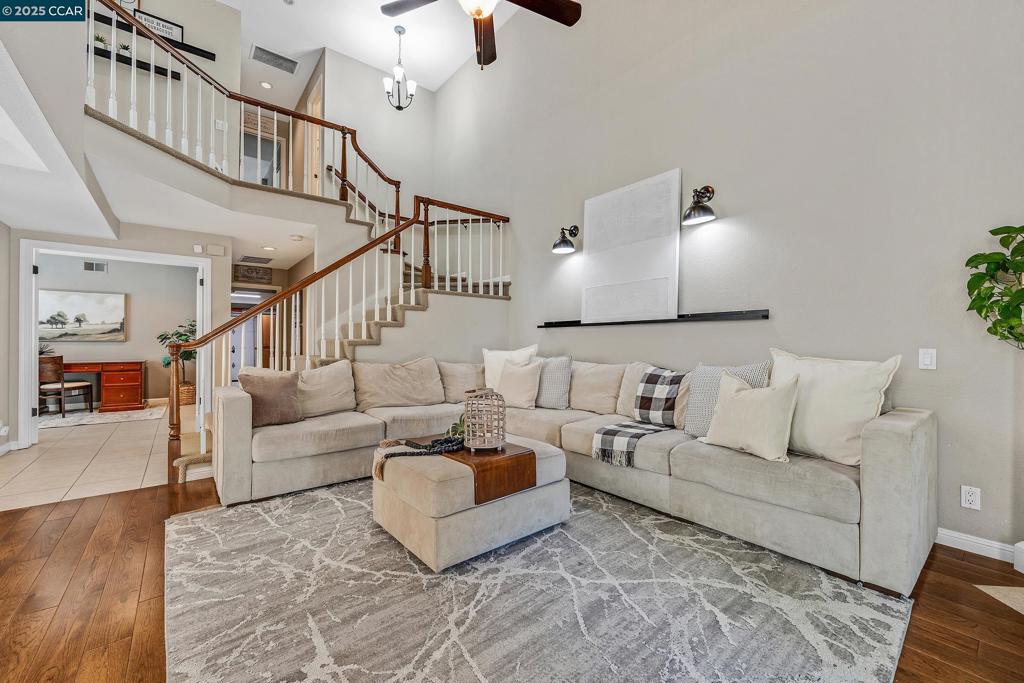 It’s hard to find a spacious 4-bedroom townhome—let alone one with soaring ceilings, 3 full bathrooms, a private backyard, and an open floor plan. This beautiful home offers all of that and more. Step inside to find a thoughtfully designed layout with gorgeous hardwood floors. The open-concept living space flows effortlessly from the updated kitchen, with a gas stove, to the family and dining areas. Downstairs features a full bedroom and bathroom—perfect for guests or a private home office. You'll find easy access to the side yard and backyard for indoor-outdoor living. The cozy fireplace and sliding glass door in the family room make it a welcoming space for gatherings or quiet evenings at home. Upstairs, the spacious primary suite boasts vaulted ceilings, a large walk-in closet, and an additional closet for extra storage. The fenced backyard is the perfect finishing touch, featuring artificial turf and a built-in storage shed. An attached two-car garage adds even more convenience and has been converted to a bonus space. Located directly across from Sycamore Park & Sycamore Elementary School, this home is nestled in a peaceful, well-maintained community with fantastic amenities, including a pool, tennis courts, and lush greenbelts. This townhome lives like a single-family home!