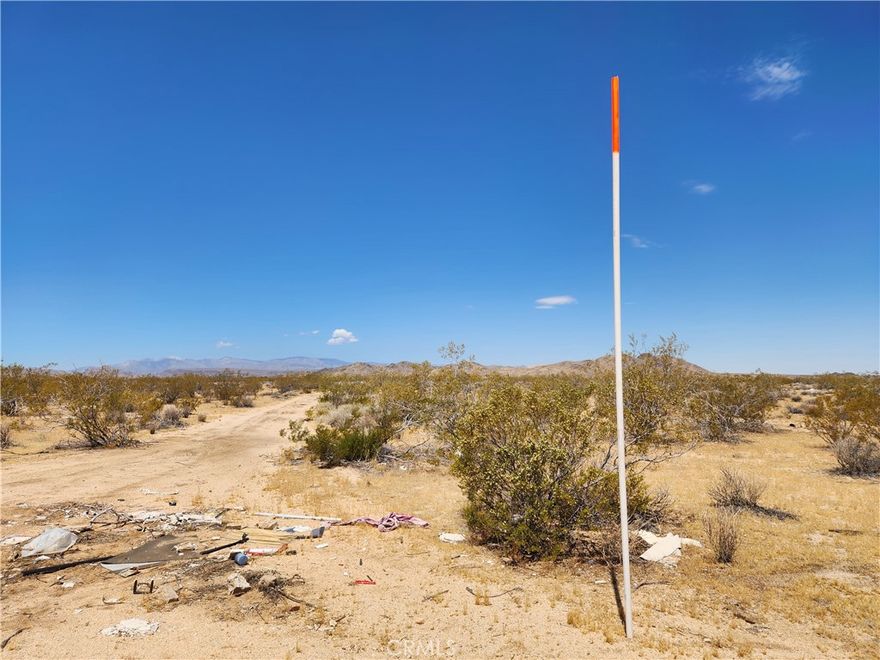 40 Acres (APN: 0631-172-37) GPS: 34.233140, -116.338395 This 40 acre property is located in Joshua Tree, CA. San Bernardino County has zoned this property Homestead Valley/Rural Living 5 Ac Minimum (HV/RL-5). The primary use is residential homes, some of the other permitted uses within this zoning are: accessory crop production, agricultural accessory structure, small family daycare facility or licensed residential care facility. Commercial renewable energy facilities are permitted in RL zoning according to the San Bernardino Development Code. Overhead electricity is available approx 1960 ft northwest of the property near Winters Rd and Lambert Ln. Joshua Basin Water District services the area, a water line is approx 0.5 miles south along Sonora Rd. Residents have septic tanks for their sewer needs and propane tanks for their gas needs. Floodway maps show the property is NOT in any flood zones and there are no blue lines within the property. Living in Joshua Tree, CA, offers a unique blend of natural beauty and laid-back desert living. Imagine building your desert getaway and waking up to bright desert sunrises, panoramic views of rugged mountains, or dark starry nights. Endless opportunities for outdoor adventures are a short drive away in Joshua Tree National Park. There's always something exciting to explore. Plus, the tight-knit community fosters a sense of belonging, with local shops, art galleries, and events showcasing the area's vibrant culture. Whether you're seeking tranquility or adventure, Joshua Tree welcomes you with open arms. This property does not yet have an address. While the boundary lines on the map offer a glimpse, they are only approximate. A Buyer should verify boundaries, zoning and utilities, ensuring every aspect aligns with their vision for the property. Nearby properties also for sale.