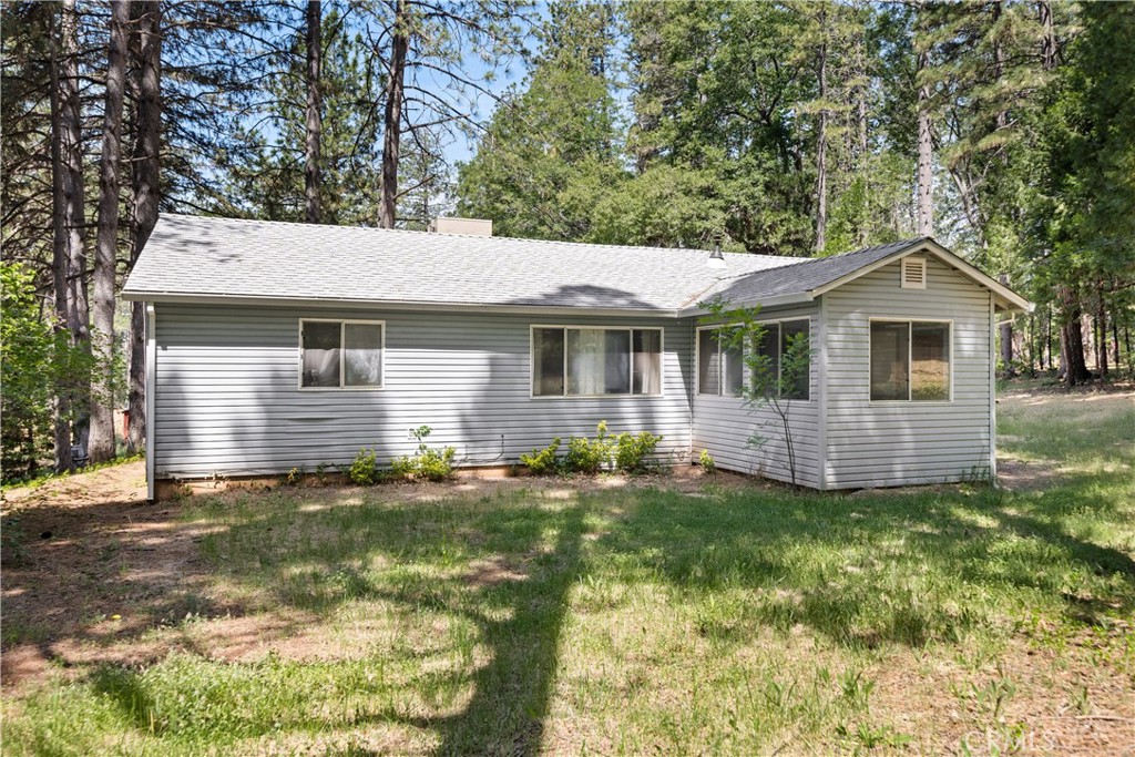 Tucked away in the pines, this Cohasset property is the perfect spot to escape the valley heat and have some elbow room and privacy! Just a short drive from Chico, this darling home sits on 3/4 of acre featuring 3 bedrooms, 2 bathrooms, a front entry sunroom, a spacious living room, and a split floorplan. On one side of the home is the master bedroom with an en suite and on the other side you will find two other bedrooms and another bathroom. The wood stove is ideal for staying cozy on cooler nights and the open living and dining spaces are a nice touch for entertaining or hosting. There is indoor laundry, a NEW well post Park Fire, and the yard offers a blank slate ready for you to grow a garden and create a backyard oasis to enjoy some peace and quiet. This property is affordable and ready for you to call home!