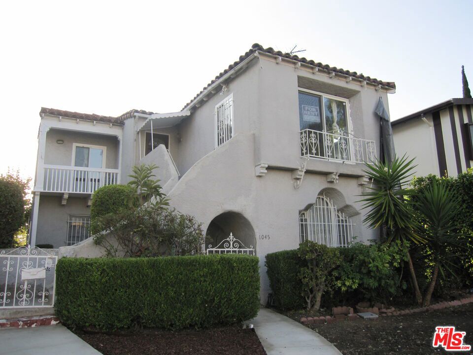 Welcome To This Charming Move-In Apartment In Beautiful Red-Tiled Roof Mediterranean 2-Family Home In Desirable Prime Location. Thoughtful Layout With High Ceilings, New Windows For Plenty Of Natural Light, 2 Balconies In Living Room & Master Bedroom. Hardwood Floors, New Gourmet Kitchen With Granite Countertops, stainless Steel Appliances Opens To Bright & Spacious Living Room And Adjoining Dining Room With Recessed Lightings & Open Floor Concept, Perfect For Entertaining. Large Laundry Room & Storage, Back Staircase From The Kitchen For Easy Access To Private Parking Space, Fireplace Is Decorative Only, Near All, Minutes Away From Shopping & Transportation.