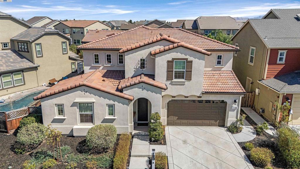 Priced to Sell! Stunning 4-bedroom, 3.5-bath home in Tracy’s sought-after Ellis community and top-rated Jefferson School District. This spacious floor plan features a full bedroom suite on the main level and a luxurious upstairs primary retreat with spa-like bath, dual vanities, and large his and hers walk-in closets. The open-concept layout offers a chef’s kitchen with a huge island, gas cooktop, pro-grade hood, and walk-in pantry. Upstairs includes a versatile loft, laundry room with sink, and even more storage. Enjoy a backyard paradise with fully landscaped Zen-like yards, and a tranquil koi pond, perfect for relaxing or entertaining. Koi will not be included with sale, but some goldfish will transfer. Solar system with $171/mo payment transfers to new owners for long-term savings. Walk to Ellis parks with pickleball, bocce, playgrounds, and bring your pup to the brand new dog park. Sprouts Market coming around the corner this fall! A rare blend of space, amenities, and lifestyle in one of Tracy’s premier neighborhoods.