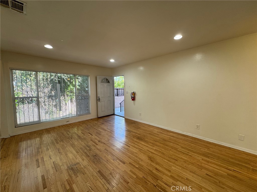 Welcome to 1372 W. 36th Street #1, a charming and spacious 3-bedroom, 1-bath 1,100apartment nestled within a well-kept quadplex in South Los Angeles. This residence is filled with character, comfort, and exceptional value. From the moment you enter, you’re greeted by rich hardwood floors and an abundance of natural light that pours through large windows, creating a warm and inviting atmosphere. The living space is accented with recessed lighting and ceiling fans, providing both style and comfort. The 3 bedrooms offer plenty of room for relaxation, work-from-home functionality, or simply stretching out in peace. The kitchen is well-equipped with included appliances, making it easy to settle in and start living. The shared laundry area adds everyday convenience, while the gated property provides a sense of community and security. An assigned parking space is included, a valuable amenity in this vibrant part of Los Angeles. Ideally located just over a mile from the USC campus, this home is perfect for students, faculty, or professionals who want to enjoy the energy of city life with the comfort of a quiet retreat. The area offers easy access to public transit, downtown LA, and a wide array of local shops, restaurants, and cultural hotspots. This inviting apartment truly offers the best of both worlds—modern amenities, classic charm, and a central location with proximity to everything Los Angeles has to offer.