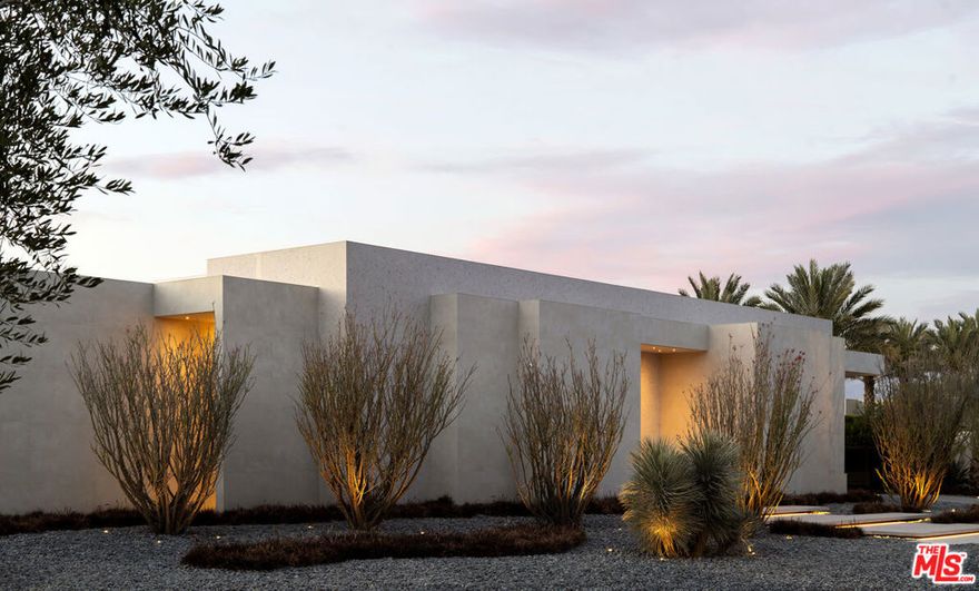 2024 Contemporary desert lifestyle as reimagined by an extraordinary artist/developer.  Paying homage to the design flair of Palm Springs of the 50's, 60's and 70's, Terrazzo, oak and concrete living together in perfect harmony as the earthy canvas for sexy, plush interiors and exquisite finishes. Stunning desert enchanted landscape with uplit mature Ocotillos and multi-headed Yuccas set the mood for this special creation like nothing else around. Total of 15,446 SF under roof (12,833 under AC) including 8 bedroom suites (2 primaries) and 13 baths (3 powder rooms). Endless amenities including a separate casita with fireplace, an additional chef's kitchen, gym, poolside movie projection, stylish cinema, two home office setups, bunk room with 3 beds and a living room, kiddie pool area, 5 oversized masonry open fireplaces, firepit area, football throwing backyard, drive-up guest suites, showroom garage, 5-car covered carport, art gallery, hotel-size bar, pool table area, shaded BBQ, outdoor shower, 20 televisions and an epic sound system.  Located on Ross Ave; the best street inside the ultra-exclusive Madison Club.