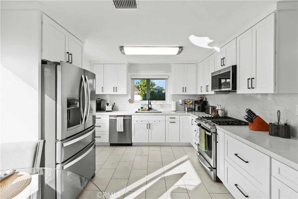 Photo of 8572 Arnett Dr, Huntington Beach, CA 92647 (MLS # OC25256182)