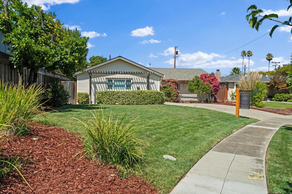 Charming Cambrian home perfectly situated on a generous lot, designed for both relaxation and entertaining. The backyard is a true retreat with vibrant lawns, fruit trees, a pergola perfect for outdoor dining and gatherings, and a spacious shed for hobbies or storage. Inside, the home was tastefully remodeled in 2015, showcasing beautifully updated bathrooms and a stunning kitchen with custom cabinetry, leathered granite counters, stainless steel appliances, including a Bosch 5-burner gas range. The dining area is highlighted by a wine fridge with wine racks, adding a touch of sophistication. This 3-bedroom, 2-bath layout includes a versatile bonus room off the kitchen, ideal for a home office or playroom. Hardwood floors, recessed lighting, and double-pane windows create a warm, inviting atmosphere, complemented by smart home features, an EV charger, and a newer roof, which add modern comfort. Ideally located near shopping, freeways, and Los Gatos, with top-rated Union schools (Alta Vista,Union, Leigh buyer to verify), this home combines comfort, style, and convenience, a true sanctuary you'll love coming home to, with too many updates to list. A must see!