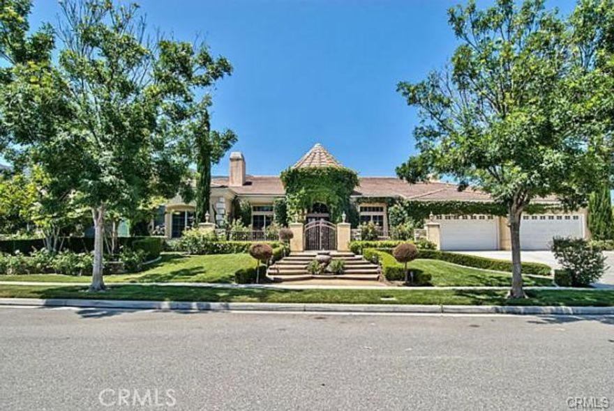 Gorgeous Tuscan Style Amber hill Estate home is located above the beautiful of South Corona. SOLAR-Powered,  This prestigious home features 5 Bedrooms & 4.2 Bathrooms & 4 car garage. The front entry welcomes you into a courtyard like setting & features a 2 tier water fountain with a iron gate front entry. Upon entering the home your eyes are drawn to the high ceilings & columns that surround the entries foyer. Crown molding and trey vaulted ceilings throughout the entire home. Retreat Master bedroom w/fireplace. Stunning formal living room and dining room, custom fireplace, wood flooring, w/ travertine accents. Open concept cookers kitchen/ dining room/ family room/ game room/ & bar has a full view of the backyard & is perfect for entertaining. Kitchen has all stainless steel appliances, double ovens, stove top w/grill, double dishwashers, sub zero refrigerator, granite counter tops, oversized center island w/prep sink, pantry, w/elegant back splash. Family room has a gorgeous rustic built-in entertainment/bookcase unit & fireplace. Separate grand office room w/French doors. Breathtaking backyard with a Salt water pool, waterfall, and in ground spa. Large covered private patio with fire pit, fireplace, BBQ & sitting area. This luxurious home is a must see!