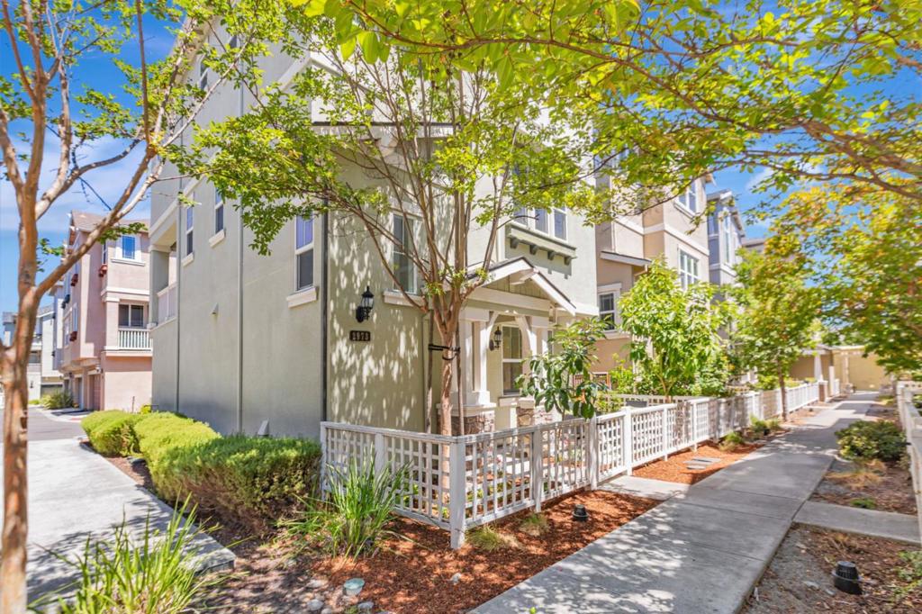 Tucked away on a quiet cul-de-sac, this 12-year-new single-family home offers 3 bedrooms, a dedicated office, 2 full bathrooms, and 2 half baths in a bright, open-concept layout. The light-filled great room opens to a private balcony, perfect for relaxing or entertaining. The gourmet kitchen features a central island, modern cabinetry, expansive granite countertops, and brand-new stainless steel appliances including range, oven, stove, dishwasher, and new exhaust fan. New vinyl plank flooring and fresh interior paint enhance the home throughout. The first floor includes a private office and half bath, ideal for working from home or potential 4th bedroom. Refreshed bathrooms showcase contemporary finishes, while the expansive primary suite boasts a walk-in closet, dual vanities, oversized shower, and updated lighting. Beautifully refinished front yard and stamped concrete side yard. Enjoy access to scenic walking and biking trails and nearby amenities like Elizabeth Lake, Central Park, and Aqua Adventure Water Park. Community perks include a clubhouse and playground. Located in the sought-after Fremont Washington School District with easy access to Hwy 680, Fremont Blvd, shopping, and schools. A rare opportunity for modern living in one of Fremont's most desirable neighborhoods!