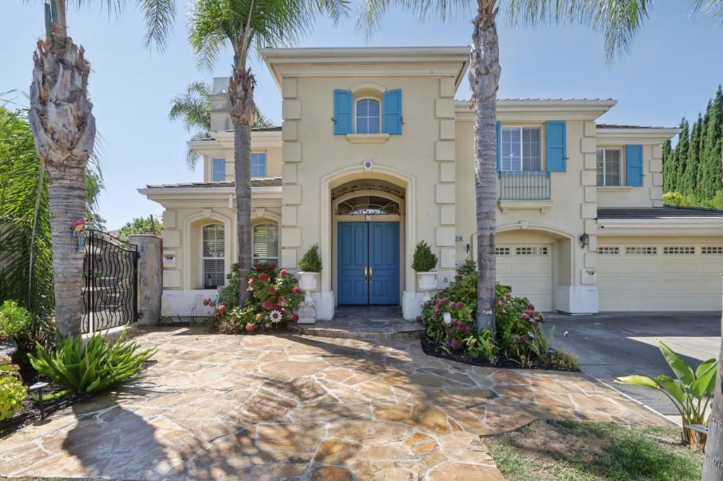Welcome to this stunning North-facing Ponderosa Ridge estate, nestled on a rare .54-acre fully landscaped lot surrounded by natural beauty. Offering 4,061 sq ft of living space, this home features 5 bedrooms, a loft, a dedicated office/den, and 3.5 bathrooms. Inside, soaring ceilings and abundant natural light create an open, elegant ambiance. The gourmet kitchen boasts a generous island, refinished cabinets, granite counters, and modern fixtures, seamlessly flowing into the formal living and dining areas with expansive mountain views. The primary suite is a serene retreat with a cozy fireplace, private balcony overlooking the San Jose skyline, and a spa-like bath with dual vanities, Jacuzzi tub, separate shower, and walk-in closet. Outdoors, 50+ mature fruit trees, lush gardens, manicured lawns, courtyards, flagstone pathways, and a fully furnished BBQ area with pizza oven provide the perfect setting for entertaining up to 200 guests or building a future ADU. A downstairs en suite bedroom, private office, brand-new carpet, and new hardwood floors add to the appeal. Built in 1999 on a quiet cul-de-sac, this residence offers unmatched privacy near top-rated schools, farmers' markets, parks, tennis, pickleball, shopping, dining, and major highways.