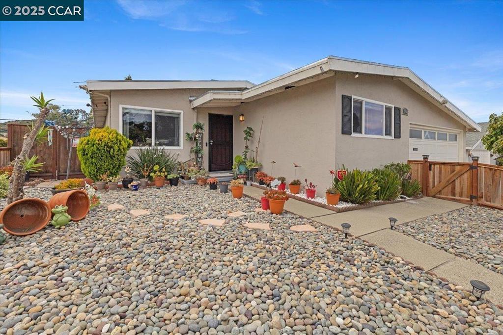 Open House August 10th, 1-4 pm. Send your clients! Great Location & Spacious Living! Welcome to this beautifully updated single-story 4-bedroom Ranch-style home with an extra-large bonus room and oversized patio—perfect for easy living and entertaining. Tucked away in a quiet, well-kept neighborhood near shopping, dining, and easy freeway access, this home has a warm, welcoming feel with plenty of natural light and space to spread out. Inside, you'll find wood floors, an eat-in kitchen, separate living and dining rooms with a cozy double-sided fireplace, plus stainless steel appliances. 3 spacious bedrooms, 1 smaller private bedroom or office near the great room. Property is equipped with solar, a smart thermostat, central heating, and a spacious attached two-car garage and EV charger. The oversized bonus room is a real highlight—ideal for a game room, home gym, movie nights, or just a great spot to hang out. Outside, the low-maintenance front and back patios, basketball hoop, and plenty of room for potted plants, relaxing, or gathering with friends and family. This home offers the perfect blend of comfort, space, and convenience—all in a great location. Don’t miss your chance to make it yours!