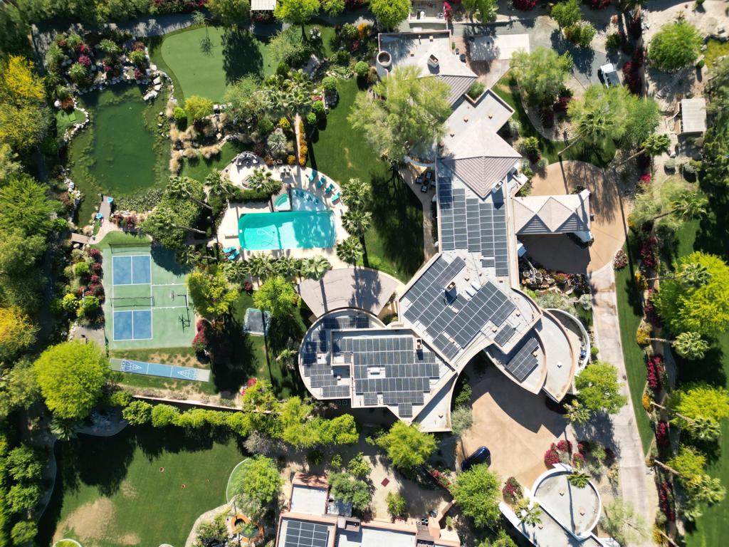 Steal this! Just reduced by OVER 1.2 MILLION $$! Owner may consider carrying some paper! Truly a MAGICAL experience with the Epitome of Privacy, Luxury, Activity & Relaxation! This is one of a kind privately gated estate with a 5-star resort like setting on nearly 2 acres w/breathtaking panoramic views & a plethora of private amenities! Including a regulation Pickleball court, Basketball court, & shuffleboard court. Fly high on the in-ground trampoline or meet on the main lawn for a game of vintage croquet. The expansive resort-style pool features a large swim deck & a spa that cascades elegantly into the water, complete with a diving board & a firepit for those cool Winter evenings. Meander beyond the pool area and invite nature into your dining experience with the lush citrus lined garden arbor dappled with twinkling sunlight and gentle shade, laced with string-lights and the sound of natural waterfalls, creating an exquisite setting for outdoor dinner parties, or intimate moments. Right outside the arbor you will find the lake-like Koi Pond complete with a dock, cascading natural rock waterfalls and two streams that flow in and throughout the backyard with bridges & pathways for your own private wildlife-filled nature walk. Next, you can drive your golf ball over the pond to the 9-hole PGA designed putting green. The Private Gym/Yoga studio has corner sliding glass walls that allow the entire gym to open to the outside. The gym has a treadmill, elliptical trainer, weight machine & free weights! Experience the luxury of your own 3-D Home Theater w/individual comfort-controlled stage seating for 9. After the movie head over to the billiard room that opens to the outdoor entertainment patio with a full kitchen and bar including a built-in beer keg tap, scotsman icemaker, sink, refrigerator, BBQ, stovetop burners, warming drawer, dishwasher & a plethora of bar seating. Just beyond the outdoor kitchen is the outdoor living room with a designer linear fireplace, radiant ceiling heaters, electric awning, built in TV, all with panoramic lush garden and mountain views. The elegant Primary Suite is privately located at one end of the house and features stunning garden and mountain views, a soaring tongue & groove ceiling, fireplace, wet bar w/fridge and sitting area. To see more remarks click MORE!