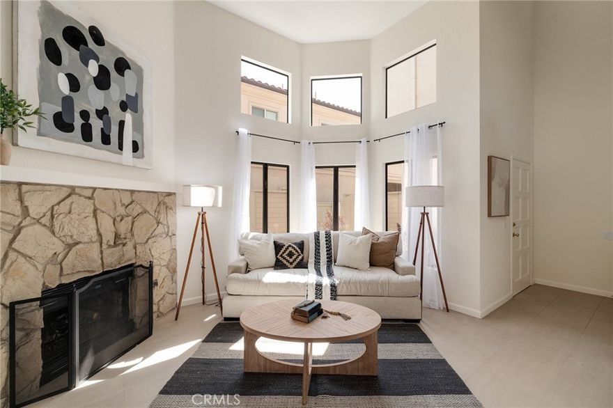 Welcome to your beachside escape at 324 N Francisca Unit 5 ! Just a few blocks from the beach and right across from Whole Foods, this awesome tri-level home is tucked away in a cozy five-unit complex, giving you privacy with all the perks of a bustling area.

You'll love the convenience of driving straight into your two-car garage and walking right into a bright, open living room with soaring vaulted ceilings and a fireplace that's perfect for chilling out or having friends over.

Head up a level to find a great dining area and kitchen, complete with a flex space that can be used for an office, big pantry, and a sleek updated powder room—all laid out with gorgeous limestone floors. It's the perfect setup for dinner parties or just hanging out.

On the top floor, the primary bedroom offers a relaxing space with an updated bath and a large closet. Plus, there are two more bedrooms and another updated full bath, all featuring fresh laminate floors—ideal for family, guests, or a home office.

Enjoy some outdoor time on your private patio, a great spot for morning coffee or evening BBQs. The place has been freshly painted and decked out with new light fixtures, giving it a fresh, modern vibe.

Located next to Boy and The Bear , Eat At Joes, the city library, restaurants &  shopping, award-winning Redondo Schools , this home has it all. Come see for yourself and enjoy the laid-back coastal lifestyle! All this and AC too!