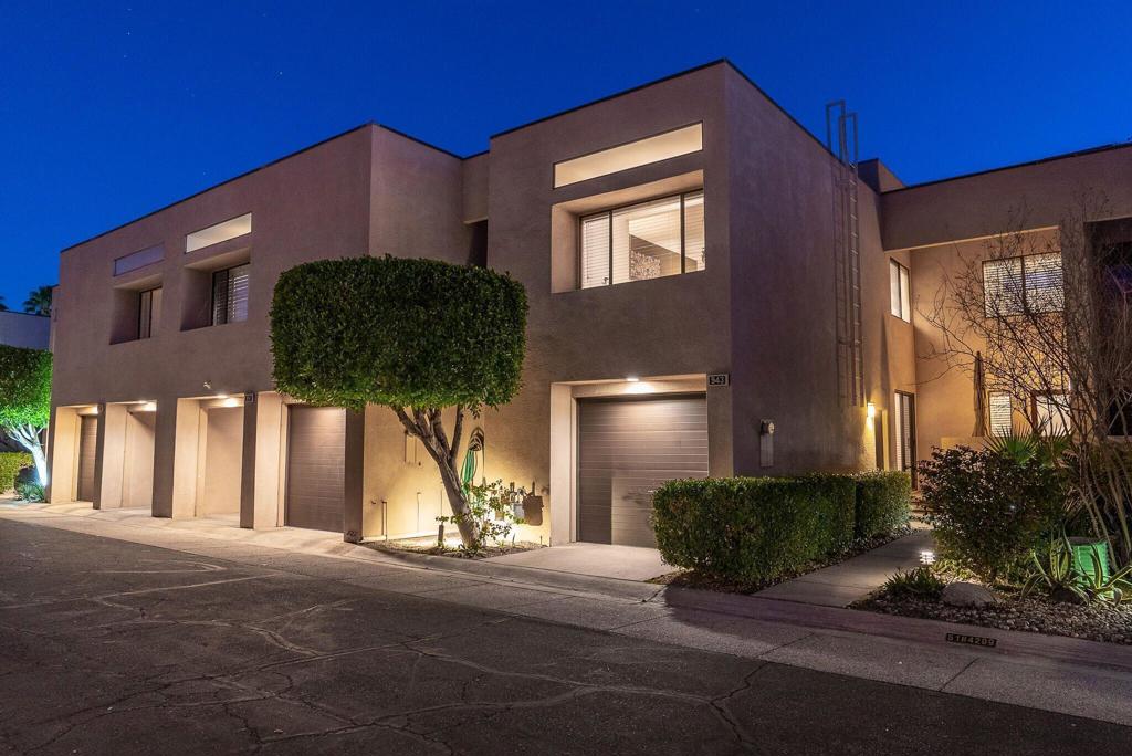 A chic peid a terre in Palm Springs! This lovely turnkey designer furnished 2 bedroom / 2 bath home at Village Racquet Club!! With over 1600 square feet of living space, this townhome is located in central Palm Springs just blocks away from the city's best restaurants and nightlife. The main level living room has a stacked-stone fireplace and vaulted ceilings that open to a private balcony. Enjoy the privacy of the quiet terrace level den, dining area, and intimate courtyard. The custom kitchen features stainless appliances and gas cooktop. The oversized primary suite has been extended, perfect for a home office or reading room, along with two walk-in closets. The home has a private, oversized one-car garage wit laundry. Village Racquet Club has 8 pools and spas, tennis and racquet ball courts, gym, and a clubhouse all within a beautifully landscaped, gated community. Perfect for a 1 month+ vacation rental income property-or- year round home.