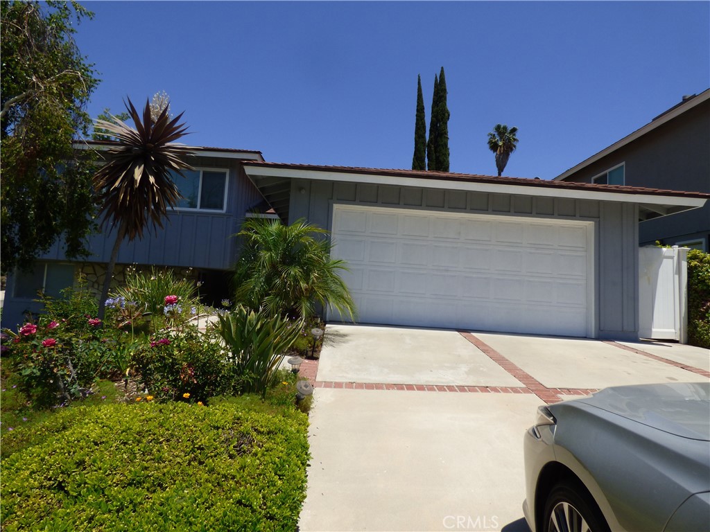 Beautifully remodeled, Furnished with new furnishers, looks like a new home, 3 Bedrooms and 2 Bathrooms, newer 55" TV, newer Washer and Dryer, newer refrigerator, newer expensive vessel sinks in the bathrooms. beautiful and large porcelain tile with newer vanity and Granit counters. Triple Pane Windows. Open, light and bright formal dining room and high ceiling living room, stunning real stone wood or gas fireplace, newer expensive Hickory wood floors in the living room, den, dining room, kitchen, stairs, hall and bedrooms, all newer expensive triple pane windows, triple pane sliding doors, exclusive costume made wood kitchen cabinetry with newer and better than granite counter tops with very large portable island, stainless steel dishwasher, stainless steel microwave and stove, newer stainless steel double sink, faucet, built in recycle, garbage, double garage w/ direct access with maple cabinets and convenient kitchen entry, coat closet, double-entry door, newer doors, new interior, newer exterior paint, fruit trees with beautiful flowers in the back yard, smooth ceiling with fan, central air and heat, recessed lights, surround sound, closed circuit TV with monitor, fully upgraded. Available immediately. Lease term negotiable