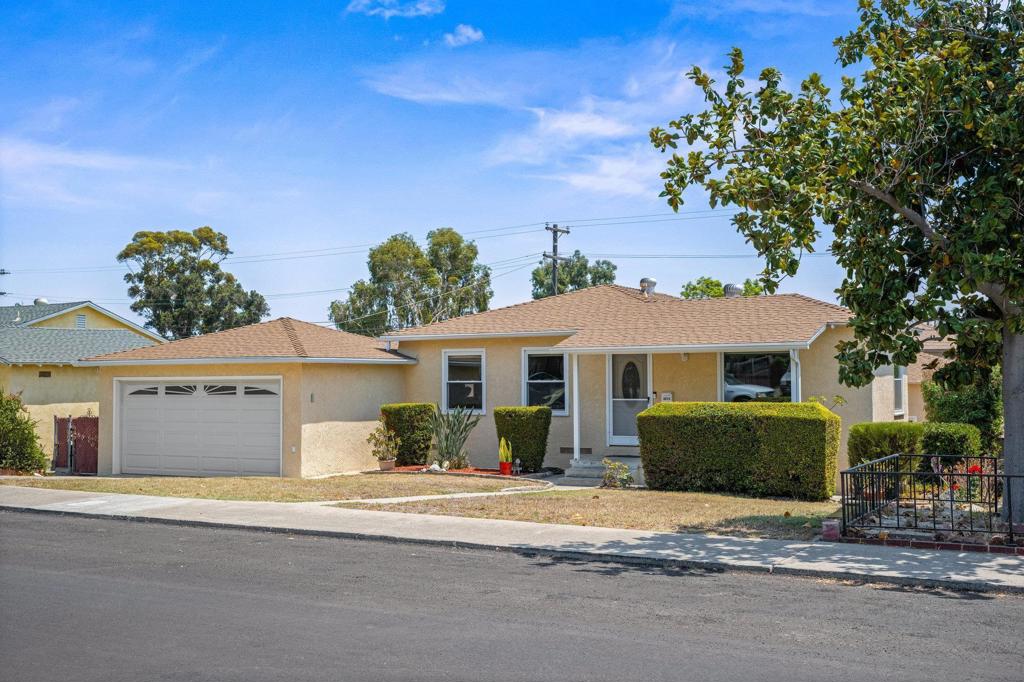 Charming Mid-Century Home in the Heart of Lemon Grove! Welcome to 3015 Olive Street, a delightful single-level home offering vintage character and modern possibilities. Located on a quiet, well-established street, this 3-bedroom, 1-bath residence sits on a generous 7,100 sqft lot—perfect for gardening, entertaining, or even adding an ADU for extra income potential. Inside, you’ll find all original hardwood floors, a bright living space, and a cozy dining area that flows into the open kitchen. The home’s thoughtful layout maximizes every square foot, while large windows bring in abundant natural light. Attic space and basement crawl space allow for extra storage and convenience. The expansive fenced backyard features mature landscaping, plenty of space for gardening, pets and play. The 513 sqft covered patio boasts a beautiful high ceiling with exposed wood beams and two ceiling fans for entertaining. The home also features a two-car attached garage plus a bonus detached permitted 520 sqft garage with alley access, offering plenty of parking and storage. Separate entry gates in the backyard offer privacy and security. Centrally located within walking distance and public transportation to schools, shopping, dining, historical landmarks, and more! Easy access to Hwy 94, 15 minutes to downtown San Diego/5/15/163 freeways and 20 minutes to the beach. This is the first time this home has been on the market in 30 years. Come and experience this fabulous space!