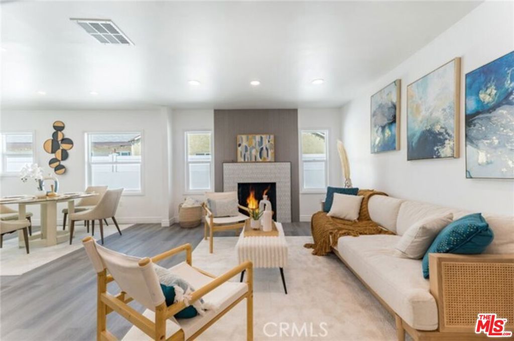 This 3Br-2Ba Home Rental Property boasts exceptional curb appeal and features a pristine open-concept floor plan with recessed lighting and complementary new flooring. The spacious living room is filled with natural light, creating a warm and inviting atmosphere. The stunning all-white kitchen is equipped with abundant cabinets, ample counter space, brand new stainless steel appliances, and an adjoining dining area. WATER AND GAS INCLUDED IN LEASE /PAID BY OWNER. Brand new central air and heating ensure year-round comfort. This stunning home includes three bedrooms, two bathrooms, including a primary bedroom that opens to a spacious and beautiful backyard. This area is perfect for enjoying quiet mornings with coffee or hosting weekend gatherings with family and friends. Conveniently located near schools, restaurants, grocery stores, parks, Canyon Plaza Shopping Center, and the 5 and 170 freeways. 2 PARKING CAR PORT SPACES INCLUDED. Everything is brand new! This is the main house.