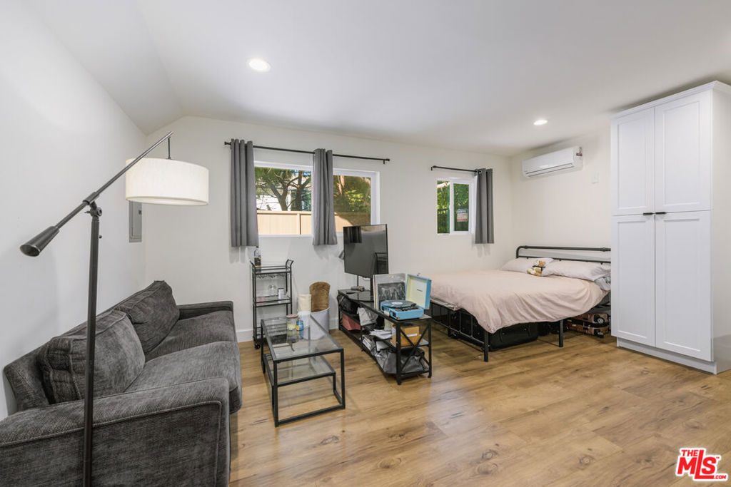 Move-in ready studio in a well-kept multifamily building near the NoHo Arts District. Open layout with recessed lighting, durable plank floors, dual-pane windows, and A/C & heat unit. Equipped with shaker cabinets, granite-style counters, gas range, microwave, dishwasher, full-size fridge, and a peninsula for casual dining. Stacked in-unit washer/dryer is neatly built in. Updated bath with modern vanity and glass-enclosed shower. Enjoy the gated courtyard patio, perfect for morning coffee and shared access to a sparkling pool with lounge areas. Convenient street parking and easy access to dining, shopping, freeways, and Metro.