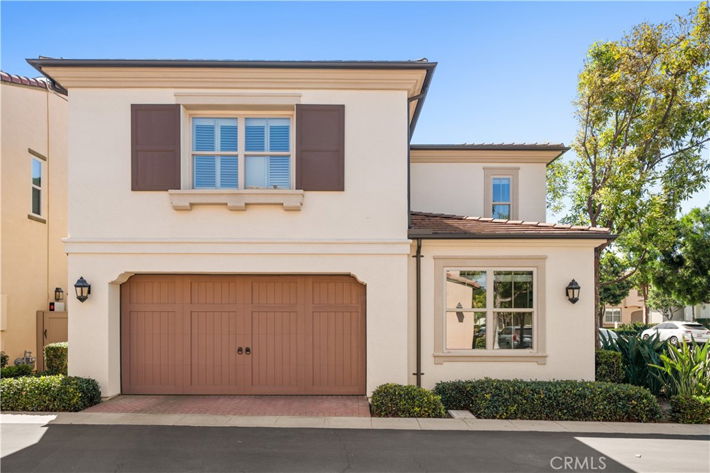 Beautifully maintained 4-bedroom, 3-bath home located in the desirable community of Stonegate Village in Irvine. This two-story residence offers approximately 2,200 square feet of comfortable living space with an open floor plan that connects the kitchen, dining, and living areas, perfect for daily living and entertaining. The kitchen features granite countertops, white cabinetry, and a large center island. Natural light fills the spacious living room, which opens to a private backyard ideal for outdoor dining or relaxation. The main floor includes one bedroom and a full bath, ideal for guests or a home office. Upstairs, the primary suite features a walk-in closet and a private bath with dual sinks, a soaking tub, and a separate shower. Two secondary bedrooms share a full bath with dual sinks and ample storage. The home also includes fully paid-off solar panels that help you save on electric bills. Residents enjoy access to community parks, pools, sports courts, playgrounds, and the Jeffrey Open Space Trail. Conveniently located near Woodbury Town Center and top-rated schools, including Stonegate Elementary and Northwood High, both Blue Ribbon Schools.