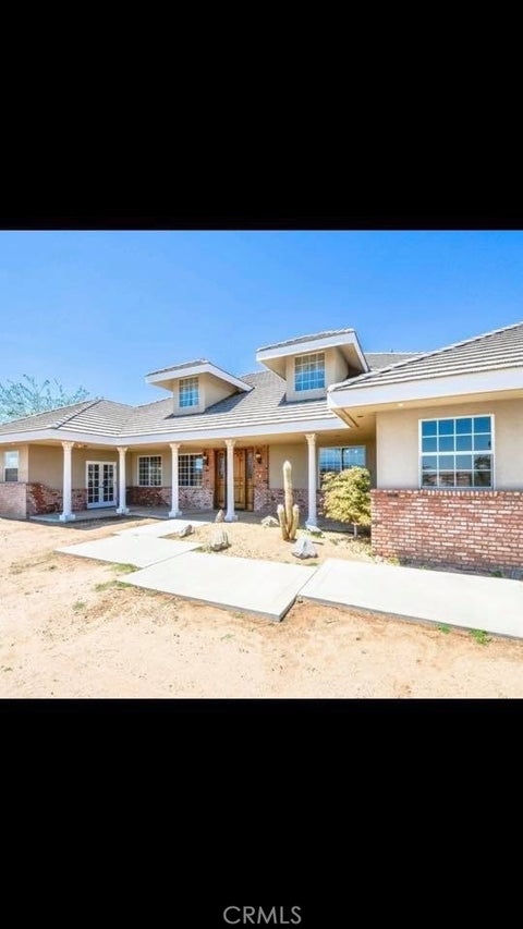 Photo of 9126 Kittering Road, Oak Hills, CA 92344 (MLS # IG26116870)