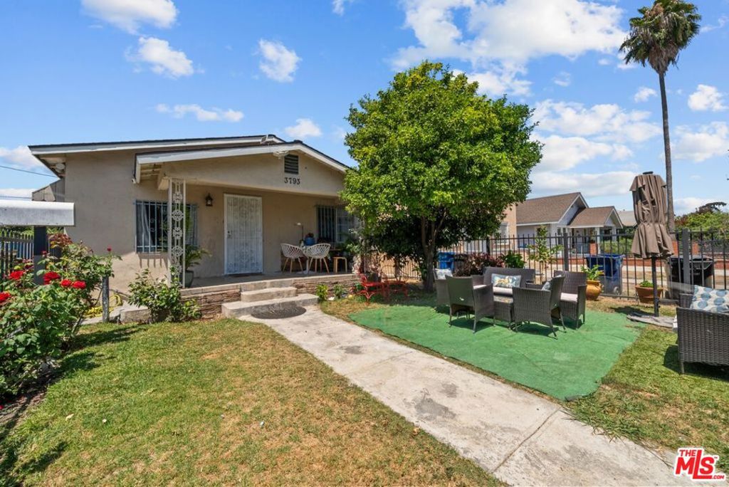 Welcome to a fantastic opportunity in the heart of Los Angeles! This charming 3-bedroom, 2-bathroom home offers a spacious and inviting layout, perfect for modern living. Step inside and you'll immediately appreciate the open and bright floor plan, which seamlessly connects the living area to the kitchen. The kitchen opens up to the backyard, creating a perfect flow for daily life and entertaining. The updated restrooms add a touch of luxury with newer tile and stylish vanities. All three bedrooms are thoughtfully designed for comfort and privacy, providing an ideal space for a family, roommates, or a dedicated home office. Another valuable feature is the recently updated roof, giving you peace of mind for years to come. The backyard is a key highlight, offering a significant opportunity to add an Accessory Dwelling Unit (ADU). Imagine the possibilities: a second source of rental income, a private space for visiting family, or a creative studio. This property provides not just a place to live, but a way to build wealth and flexibility. The detached garage is a major bonus, already finished and includes a restroom, making it a perfect candidate for an ADU conversion. The location is truly unbeatable, just minutes from USC, making it ideal for students, faculty, or anyone who wants to be close to the vibrant campus culture. With the upcoming 2028 Olympics, you'll be in the center of the action, with quick access to all the venues. This home combines comfort, convenience, and a prime location in a highly sought-after area. Whether you're a first-time buyer looking for a great community, a family needing space to grow, or an investor seeking a high-return property, this home has it all. Don't miss your chance to own a piece of LA's future. Schedule your viewing today and discover the endless possibilities!