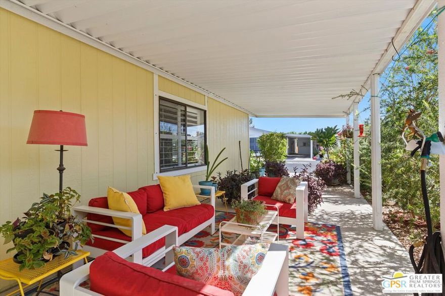 Embraced by colorful gardens, mountain views and shaded outdoor spaces on both sides, this move-in-ready residence elevates indoor/outdoor living to new heights at Palm Desert's 55-and-better Suncrest Country Club. Built in 1986, the manufactured home is open and bright, with two bay windows welcoming natural light into the seamless living and dining room space and vaulted ceilings lending a sense of openness throughout. Approximately 1,344 square feet, the residence showcases newer woodgrain laminate flooring, upgraded granite countertops in the kitchen and baths, a NU Aqua water filtration system, plantation shutters, mirrored wardrobe doors, ceiling fans and fresh paint. The kitchen flows directly to the dining room and hosts white cabinetry, stainless steel appliances, a peninsula, and full tile backsplash. An oversized laundry room off the kitchen opens to the outdoors and presents a built-in desk with granite top. Two private bedrooms and two baths include a spacious primary suite with generous closet, a soaking tub and separate shower. Settled in a quiet and serene area of the community, this lovingly maintained home offers a seating area, large storage space and golf cart parking on the carport side, while the entry side features a full-length patio that is primed for entertaining. Located in the western end of Palm Desert near Rancho Mirage and Palm Springs, Suncrest Country Club is home to a luxurious clubhouse with billiards, library, pro shop and the popular Jazzy J's cafe. Residents appreciate having easy access to three swimming pools, in-ground spas, lighted tennis and pickleball courts, and a gorgeous 9-hole golf course. Premium resorts, abundant shopping, countless restaurants, and Eisenhower Medical Center are moments from home.