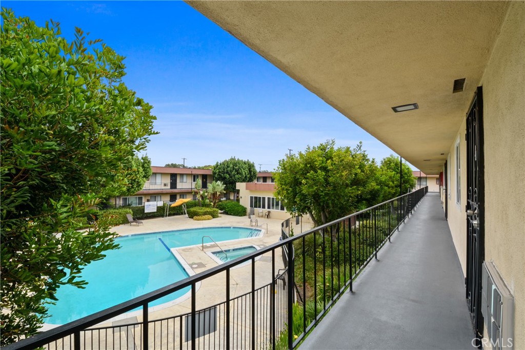 Bright & Updated Top-Floor Condo with Pool Views and Garage Parking! Welcome to this nicely updated 2-bedroom, 1-bath top-floor corner condo, offering abundant natural light and serene views of the sparkling pool and spa. Inside, you’ll find a spacious living area with newer dual-pane windows and modern laminate flooring. The open kitchen features white cabinetry, granite counters with a stylish tile backsplash, and gas range — perfect for cooking and entertaining. This home includes two dedicated parking spaces, one in a private garage and another reserved spot. The Clair Del community offers fantastic amenities including a pool, spa, barbecue area, two community rooms (one with a pool table and ping pong, and another available for private gatherings), plus two laundry facilities. With low HOA dues that cover water, trash, gas, and community upkeep, this is an excellent opportunity for convenient and affordable living. Ideally located near Lakewood Country Club, Bixby Knolls, and the Long Beach Exchange (LBX), you’ll enjoy easy access to shopping, dining, and entertainment. Some lenders may offer special financing incentives, including down payment assistance or grants, subject to lender availability and buyer qualifications. VA Approved condo community.