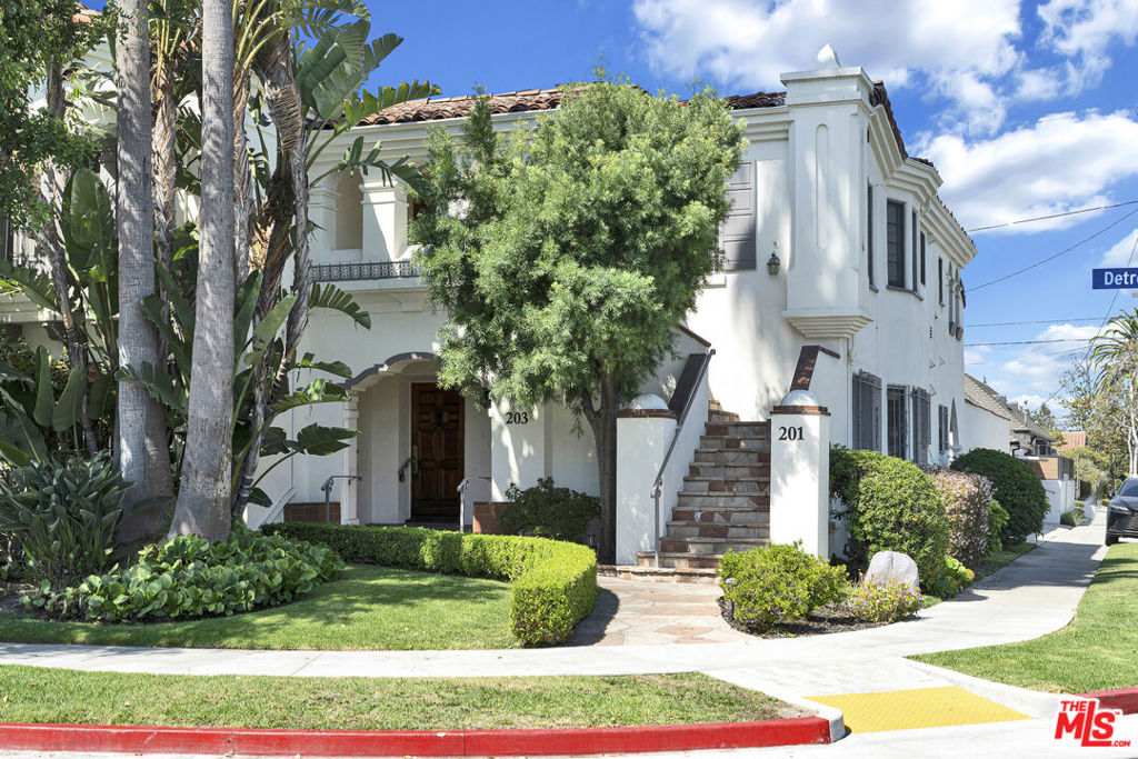 Beautiful Spanish Colonial duplex in the heart of Miracle Mile, full of charm and character. The units have recently been remodeled. Each spacious unit offers 2,590 sq. ft., 3 bedrooms, and 3.5 bathrooms with bright, open layouts. THE DOWNSTAIRS UNIT WILL BE DELIVERED VACANT - perfect for an owner-user or investor. Features include hardwood floors, updated kitchens and baths, stainless steel appliances, stone countertops, breakfast nook, wet bar, formal dining room, and large living rooms with fireplaces. Enjoy private patios/balconies, abundant natural light, individual washer/dryer hookups, recessed lighting, and backyard space. Modern upgrades include updated electrical and plumbing, central air & heat, new main sewer line, solar panels, EV charging, and security cameras. There is a 2-car garage. Don't miss this rare opportunity to own a timeless property with modern amenities in one of LA's most sought-after neighborhoods. Minutes from Downtown Los Angeles, Beverly Hills, The Grove and Hollywood. Walk to places of worship. The property is located in HPOZ Zone. Upstairs unit is occupied. PLEASE DO NOT DISTURB TENANTS.