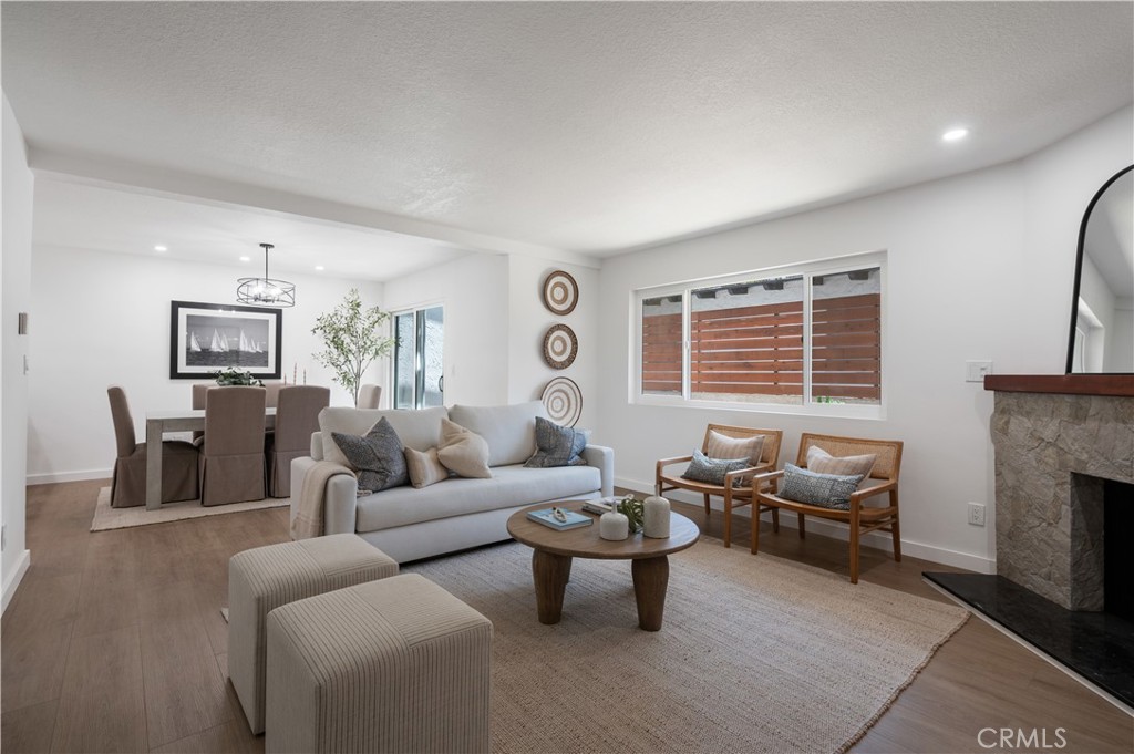 Totally remodeled Manhattan Beach townhome minutes to the beach, pier, shops & dining. Light-filled 3-bed, 2.5-bath with open floor plan, new wide-plank floors & stone fireplace. Brand-new kitchen with breakfast bar, custom shaker cabinets, quartz counters, tile backsplash & stainless appliances. Private patio for indoor/outdoor living. Primary suite with high ceilings, balcony & remodeled bath. Two guest bedrooms & updated full bath. Updated lighting, hardware, cabinets, new windows throughout, new heating system & large laundry room with washer/dryer. Finished 2-car garage with epoxy floors, storage & parking space in front. Low $134/mo HOA. Near award-winning schools, Polliwog Park, Manhattan Village, Trader Joe’s, LAX & 405. Move-in ready coastal living!
