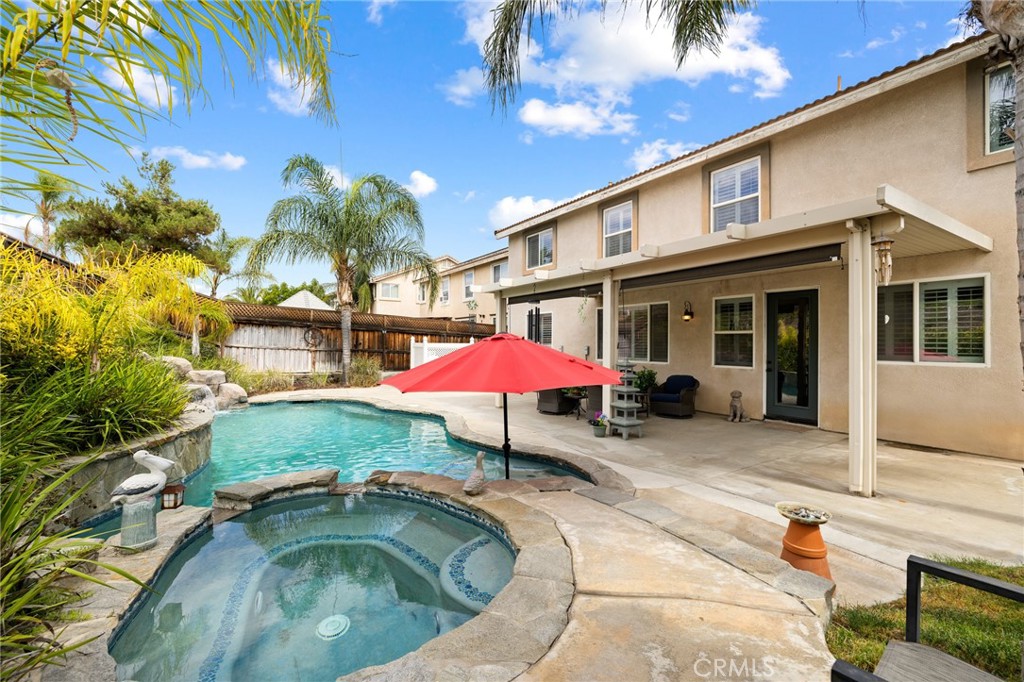 This Murrieta POOL HOME is THE ONE, offering NO HOA, LOW taxes, 5 bedrooms, 3 baths and a 3-car garage. This beauty is hitting the market for the first time since it was built, with only one owner, and the pride of ownership shows throughout the entire property. As you enter the 3000 sqft home you are greeted by tall ceilings, custom paint, tall baseboards, LVP floors and shutters throughout. The formal living and dining areas greet you with endless options to have the space used any way you like. The updated kitchen is a showstopper with granite counters, an eat-up island, stone backsplash, white cabinets, newer stainless-steel appliances, a custom pantry door leading to the walk-in, LED recessed lighting, and tile floors. The family room offers tons of natural light from large windows, LVP floors, a gas fireplace, a TV entertainment center and flows right over to the MAIN FLOOR bedroom offering plush carpet, and a large closet. The main floor bath features Tiffany blue paint, an updated vanity, mirror, lighting and a walk-in shower which is just off the entrance to the three-car garage. The upgraded staircase features a new wrought iron railing leading the way to the second story boasting a giant loft currently being used as a movie room. The three other extremely large secondary bedrooms are on the second floor as well featuring new paint and plush carpets and share a secondary bath appointed with a dual vanity and shower tub combo. The second story laundry room boasts lilac paint, white cabinets and a wash sink. The massive primary suite offers gorgeous views of the backyard, new paint with a gorgeous accent wall and an attached bath appointed with custom paint, white cabinets, dual vanity with granite counters, soaking tub with a beautiful chandelier, standing shower, stone backsplash, a seated vanity, and large walk-in closet. Step outside into your private oasis and you will find a large aluma wood patio cover with sunshades, concrete for entertaining, a grassy area with large palm trees and a gorgeous chlorine pool and spa with water falls surrounded by lush greenery. Located in the heart of Murrieta, minutes from downtown, local shopping, the infamous Murrieta dog park, the 15 freeway, and is part of the Murrieta Unified school district with boundaries for Murrieta Valley HS, Thompson MS and Tovashal ES; this is a home you do not want to miss!