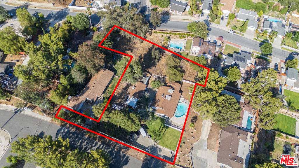 Opportunity knocks at this rare offering in the urban heart of Santa Clarita. Situated on a flat useable acre where possibilities are endless. Per The City, zoning is UR2, Urban Residential and lot size can accommodate up to seven horses, yes horses! Now let your imagination run wild.... Family Compound, addition, future horse property, remodel, expand, build an ADU, subdivide, develop??? Private gated entry with long wide driveway can accommodate ample cars, trucks and recreational vehicles. Picturesque sparkling pool/spa with captivating city light and mountain views. Current use is a single story four-bedroom home with a finished attic space ideal for additional storage featuring central HVAC and a detached garage. Don't miss this chance to polish up this diamond in the rough or redefine the use entirely. No mello-roos, no HOA and easy access to transportation and the 14 freeway.