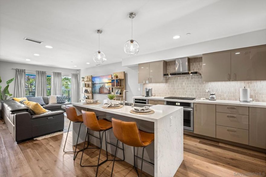 Welcome to your stunning multilevel townhome in the heart of Point Loma, where modern sophistication meets coastal charm. Just moments from Shelter Island’s waterfront, sandy beaches, and the village vibe of Point Loma, this luxurious home offers an exceptional lifestyle. Take in panoramic views of wooded hills and the San Diego Bay from your private rooftop deck—ideal for entertaining or unwinding at sunset. Inside, enjoy a thoughtfully designed interior with a gourmet kitchen featuring Jenn-Air stainless appliances, quartz countertops, and abundant cabinetry. The spacious layout offers three bedrooms, three full baths, and a powder room—perfect for both everyday living and hosting guests. Spa-inspired bathrooms showcase elegant tile and frameless glass showers, creating a serene, upscale retreat. Located in one of San Diego’s most desirable coastal neighborhoods, you're just a short stroll to Liberty Station’s dining, shopping, and recreation. With marinas, bayfront paths, and vibrant entertainment venues nearby, this home blends luxury living with the best of coastal San Diego.  Welcome to your stunning multilevel townhome in the heart of Point Loma, where modern sophistication meets coastal charm. Ideally located just moments from Shelter Island’s scenic waterfront park, sandy beaches, and the quaint village atmosphere of Point Loma, this luxurious home offers an unparalleled lifestyle. Enjoy sweeping panoramic views of verdant wooded hills and the sparkling San Diego Bay from your private rooftop deck—perfect for entertaining guests or unwinding with spectacular sunsets. Inside, discover a thoughtfully designed interior featuring a gourmet kitchen complete with top-of-the-line Jenn-Air stainless steel appliances, sleek quartz countertops, and abundant cabinetry for all your storage needs. The spacious floor plan includes three bedrooms, complemented by three full bathrooms and one half bathroom, providing ample convenience for family and guests. Relax in spa-inspired spaces adorned with elegant tile work and oversized frameless glass showers that evoke a serene, upscale retreat. Point Loma is one of San Diego’s most coveted coastal neighborhoods, offering seamless access to Liberty Station’s vibrant dining, boutique shopping, and recreational options—all just a short stroll away. With nearby marinas, waterfront pathways, and lively venues for concerts and entertainment, this residence combines luxury living with the best of coastal San Diego.