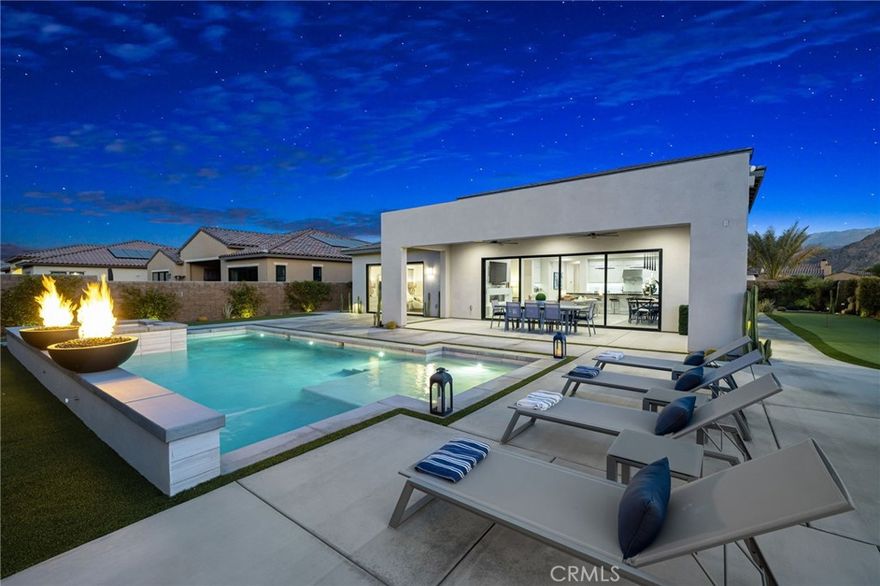 Available Feb 2026.  Welcome to Stone Creek Ranch, a coveted gated community in La Quinta. This stunning home offers the perfect blend of luxury and privacy. Well positioned on an oversized corner lot, the property offers 4,013 square feet of living space with 5 bedrooms, 4.5 baths, including an additional flex space for entertaining upstairs and a back yard that revels a coveted resort.  Upon entry, a cozy living area greets you offering a space for imtimate gatherings or quiet area for work or reading.  The grand great room with its high ceilings and open concept is where memories will be made with family and friends.  A substantial island with upgraded appliances and cooking items allows the home chef to lay out a spread.  Whether enjoying the game on the big screen or hosting an event, there is plenty of space for dining and relaxing.  Large glass sliders offer seamless entry onto the oversized backyard with large pool with baja shelf and attached spa.  For the golfer in you, practice your game on the outdoor putting green or in the simulater located in the garage.  The main level offers the primary suite and 2 additional guest rooms.  Up the stairs an additional bonus room wet bar and outdoor space provide more space for enjoyment with guests.  Two additional bedrooms and bathrooms complete the upstairs.  If you are looking for an "wow factor" space in the Coachella Valley with privacy and adesirable location, this is it.  $12000/month is for a long term lease. Monthly rates will vary depending on time of year and lease term- contact for details.