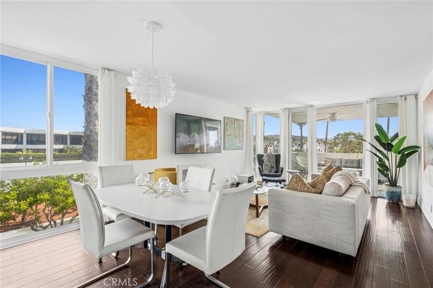 Experience coastal luxury living in this stunning top-floor, end-unit penthouse located in the heart of Corona del Mar! This light and bright 2-bedroom, 2-bathroom residence offers an open-concept floor plan with designer finishes and abundant natural light. The modern kitchen features sleek Bosch appliances and quartz countertops. The spacious living and dining areas flow seamlessly to a private balcony - perfect for enjoying ocean breezes and vibrant sunsets. 
The primary suite boasts a beautifully appointed en-suite bathroom and generous closet space, while the secondary bedroom is ideal for guests or a home office. Additional highlights includes in-unit laundry, premium finishes throughout and a detached 2-car garage that is gated and secure.  
Nestled in a prime location south of the PCH near beaches, up-scale dining and boutique shopping, this penthouse embodies the best of coastal Orange County living.