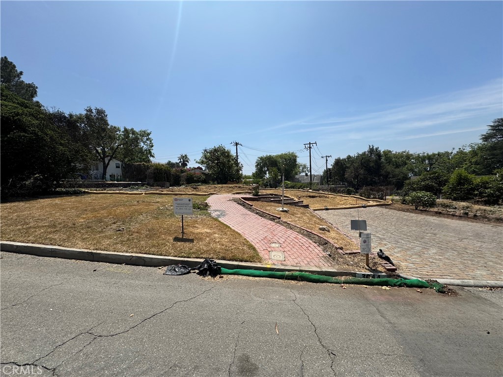 Prime Altadena Lot – Rare Development Opportunity
Nestled on one of Altadena’s most desirable and picturesque streets, just moments from scenic Mount Lowe Park, this expansive 13,140 sq ft lot (per LA County Assessor) with gently sloping landscape presents a unique opportunity to build new in one of the area's beloved neighborhoods. With its stunning mountain views to the north, a view of downtown LA to the south, and close-knit community feel, this location offers the perfect canvas for your next project.
Originally home to a nearly 3,000 sq ft residence lost in the Eaton Canyon fire, the lot spans two parcels—opening the door for possible lot division and individual development (buyer to verify). The lot has since been cleared by the Army Corps of Engineers and fully signed off by LA County Public Works. The land is now ready for a new chapter.
Adding to its charm, the property is graced with mature fruit trees and two thriving avocado trees that survived the fire—bringing life, shade, and character to the grounds.
This is a rare chance to build new in an established, scenic Altadena enclave—ideal for developers, custom home builders, or end users looking to create a personal oasis with views, tranquility, and space to grow.
Please Note: Drive by only. For your safety please do not walk on the site..