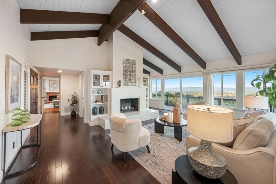 Peaceful Woodside Retreat with Sweeping Bay Views Welcome to 168 Sunrise Drive, a serene retreat in the heart of Skywood Acres where you'll enjoy breathtaking panoramic views of the Bay, stretching from San Carlos to San Jose. Set on a spacious 53,577± sq. ft. lot, this home offers both privacy and connection to nature. A long driveway leads you to the inviting residence, surrounded by mature landscaping, lush foliage and the quiet beauty of Woodside's countryside. Inside, the home features 2 bedrooms, 2 baths, and a versatile bonus room perfect as an office, studio, or guest space. Vaulted ceilings and floor-to-ceiling windows fill the open living areas with sunlight, creating a warm, inviting space with stunning views from nearly every room. Step outside to a sunny deck and sparkling pool, the perfect place to relax, entertain, or take in the peaceful surroundings. Experience the best of Woodside living - privacy, natural beauty, and views that truly take your breath away. Just minutes from Menlo Park, Palo Alto, and top schools, it offers the rare blend of privacy, prestige and convenience.