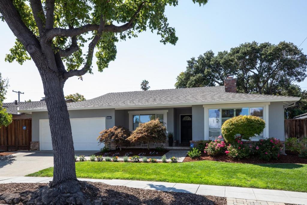 Located in Sunnyvales most sought-after neighborhood of Ortega Park, this 3 bedroom, 2 bath home has undergone a total renovation perfectly blending modern living and timeless elegance. With approximately 1,936 sq ft of living space, it offers premium finishes throughout. New luxury vinyl flooring, spacious kitchen and designer color palette. The generous living room has a wood burning fireplace and natural light exudes through the expansive windows. The updated kitchen seamlessly connects to the spacious family room and dining area. The kitchen itself offers an abundance of white shaker cabinetry, quartz countertops with complimentary backsplash and new stainless-steel appliances. The dining room has skylights and French door opening to the rear yard. Whether entertaining on the dining terrace, playing on the lawn or relaxing under the heritage oak, the yard feels like its own private oasis. All bedrooms are generous in size; primary suite offers a walk-in closet, spa-inspired bath and French door to the rear yard. Additional features include LED lighting, central heating, double pane windows, inside laundry and attached two-car garage. Just a short drive to downtown shopping, dining, farmers market, ideally situated near major tech companies and award-winning Cupertino schools.