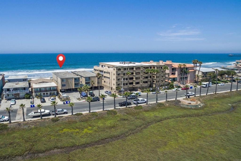 If you have ever wanted the sand & waves as your private backyard, now is the chance. This OCEANFRONT COMPLEX is perfect if you’re looking for a beach lifestyle!! The Surf and Sand Complex has undergone renovations last year to enhance its beauty. Each unit received beautiful new windows and the entire building has new exterior paint and stucco! This 2 bed/2 full bathroom condo was completely renovated 5 years ago and is COMPLETELY MOVE-IN READY! Situated on the South end of Seacoast Drive, its location across the street from the Estuary provides additional street parking and is less noisy and congested than areas north of IB Blvd. It is a sought-after area in this charming beach community. The primary bedroom has its own full bath attached and the second full bathroom is where you’ll have your own IN-UNIT LAUNDRY. You will also enjoy your very own outdoor space that is situated just off the kitchen with your own private balcony that faces the Estuary. In addition, you have your very own assigned parking space AND additional storage in the parking area that is shared with just 2 other homeowners. There is plenty of room for bikes, surfboards, kayaks and more. This south end of Seacoast Drive is a coveted little gem in Imperial Beach yet close enough to walk to dining, bars, shopping and fishing off the pier. You'll enjoy watching the sunrise over the Estuary and beautiful sunsets over the Pacific Ocean. In addition, your backyard space offers a relaxed area to hang out with friends & family and enjoy fireworks off the Pier during the 4th of July. If you are ready to fall asleep listening to the waves from inside your home, this is the perfect place for you.