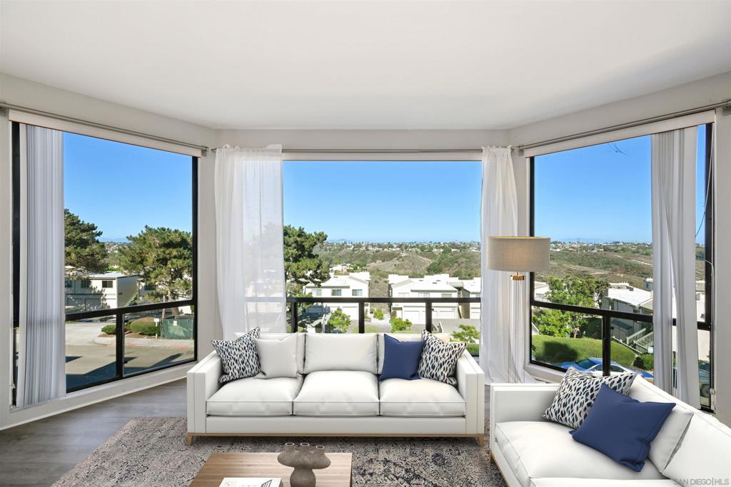 Experience breathtaking views from this exceptional end-unit residence featuring an open floor plan and expansive windows that fill the home with natural light. This rare single-level layout offers two spacious bedrooms and two full bathrooms, including a primary suite with a walk-in closet and private bath. Thoughtfully designed, the second bedroom is situated on the opposite side of the home, creating the feel of dual primary suites—ideal for privacy or guests. The modern kitchen is outfitted with sleek quartz countertops and stainless steel appliances, perfect for both everyday living and entertaining. Enjoy the convenience of interior laundry and the bonus of a generous 8x8 on-site storage unit. Located within walking distance to dining, shopping, coffee shops, parks, and the trolley, this home places you in the heart of Bay Park with quick access to golf and Mission Bay. A perfect blend of comfort, style, and convenience—this is San Diego living at its best.