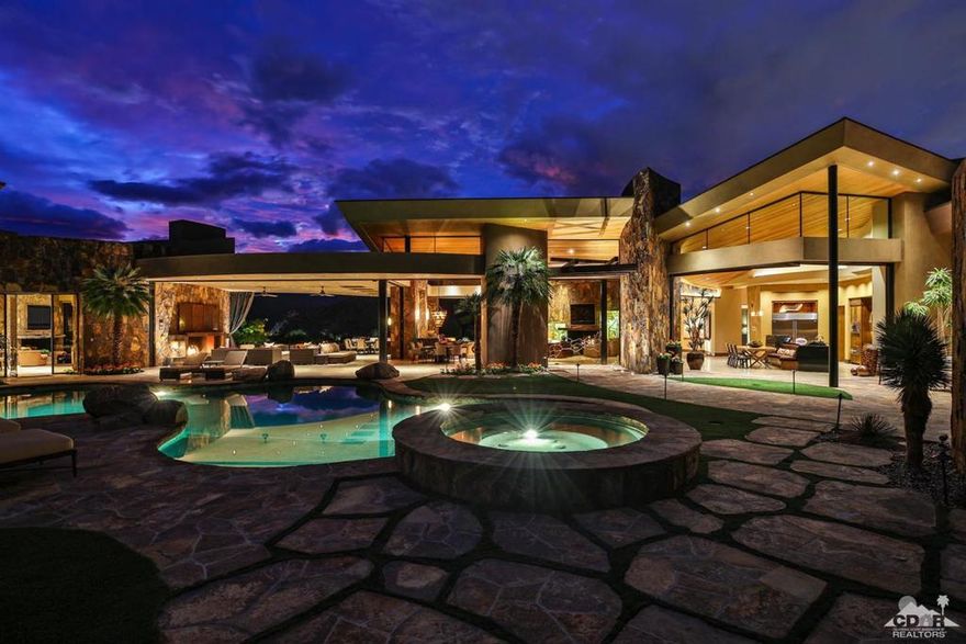 A contemporary jewel at the exclusive Reserve Club in Indian Wells. Architectural design by Kristi Hanson, this home is spectacular with mahogany ceilings, custom wood doors, exercise room, golf simulator, private fully self contained three bedroom guesthouse with three bathrooms, kitchen and laundry over looking the pool, indoor-outdoor living with massive custom glass doors. Home is being sold fully furnished, with furnishings by Blackbird Interiors. Artwork and sculptures are excluded. Tucked against the Santa Rosa Mountains, in both Indian Wells and Palm Desert, The Reserve's geographic location provides unparalleled privacy and natural beauty. Desert landscape flows seamlessly along the 21-hole course and offers panoramic views of the Coachella Valley at every turn. Reflections on serene lakes, waterfalls and abundant wildlife make this desert retreat feel timeless.