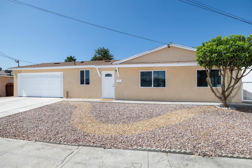 Picture-perfect and move-in ready! This charming 3-bedroom, 2-bath home sits on an expansive lot and has been thoughtfully renovated throughout. Recent upgrades include a brand-new kitchen, beautifully updated bathrooms, luxury vinyl plank flooring, dual-pane windows, a new water heater, and a 30-year roof. The finished garage adds even more functionality. Designed with convenience in mind, the home offers level entry with no steps—ideal for easy access. The large backyard provides endless opportunities: expand the home, create a poolside retreat, or explore the potential for an ADU or guest suite. Located in a welcoming neighborhood close to shopping, schools, and parks, this home combines modern comfort with everyday convenience.