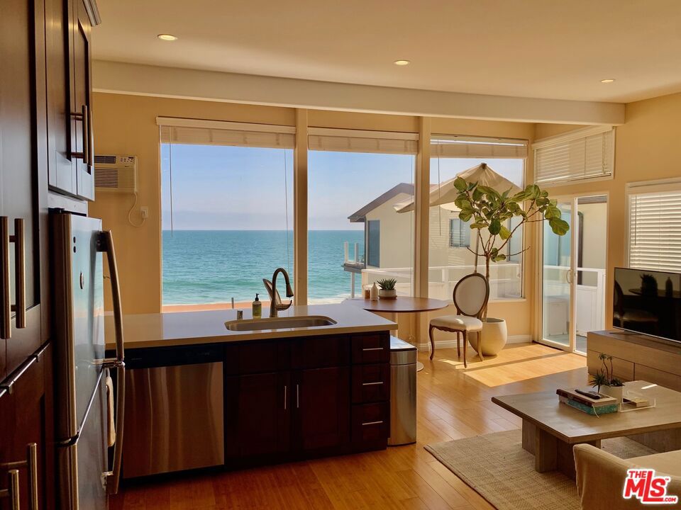 On Malibu Road Beach Side. Large One Bedroom / One bath, upstairs unit with White Water Ocean Views. Ocean views from deck, living room and kitchen. Recently updated kitchen and bathroom, Hardwood floors, large closet, covered garage parking for 1 car, plus one parking space behind garage. Laundry in unit. "Minimum one year lease". Ask about Pets. Bright and open unit with beautiful Malibu Beach views. Direct beach stair access. Available now. Call for Showing.